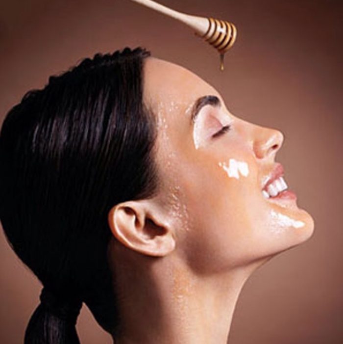 Woman pouring Honey on Face